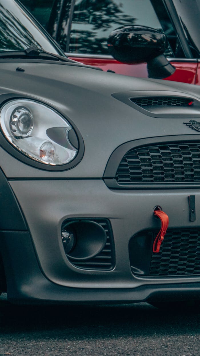 Detailed front view of a luxury car showcasing its sleek design and sporty features.